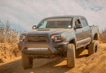 Picture of Cali Raised 05-15 Toyota Tacoma Low Prof Ditch Light Brackets Kit W/ Amber Backlight - Tall